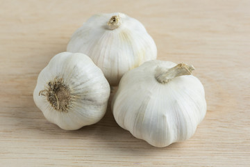 Garlic on wooden cutting boards.