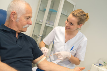 nurse taking a blood sample