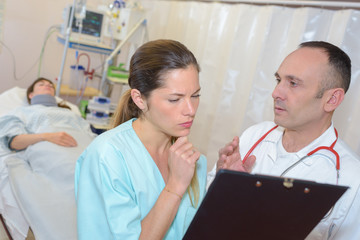 doctor talking to a nurse