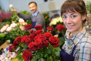 Fototapeta premium female and male florist in working in flower shop