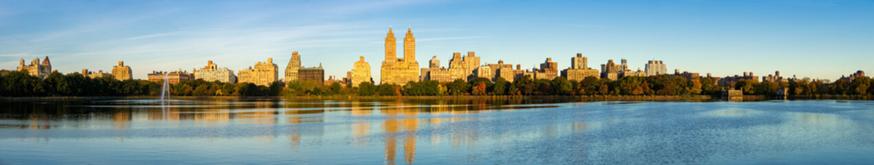 Panoramic morning view of the Upper West Side with the Jacqueline Kennedy Onassis Reservoir and Central Park in Fall. Manhattan, New York City