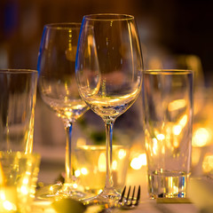 Glass of wine on the table,Romantic Dinner wedding set up.