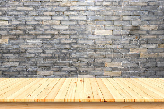 Wood Table And Old Brick Wall Background.