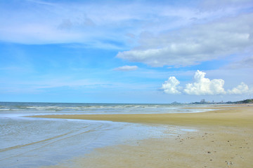 Fototapeta na wymiar View of summer beach with blue sky background in HUA HIN THAILAND.