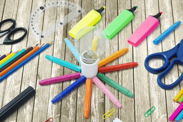 School supplies with a bulb on the table