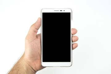 Hand holding smartphone with blank screen isolated on white background.