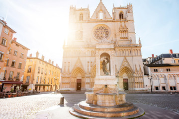 View on the saint Johns cathedral with the statue of Jesusd uring the sunrise in the old town of Lyon city