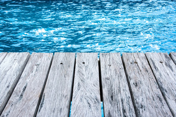 wooden terrace and sea reflections.