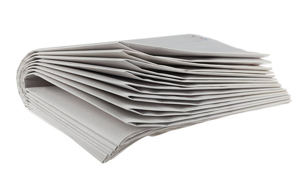 Folded newspapers isolated on white background.    