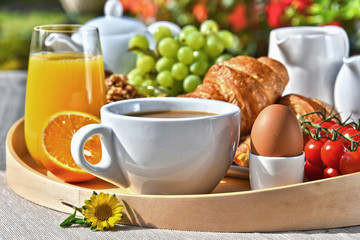 Breakfast served with coffee, juice, croissants and fruits