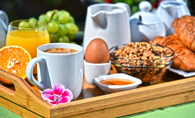 Breakfast served with coffee, juice, croissants and fruits