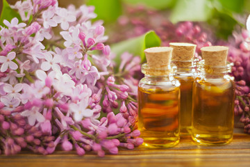 Essence of flowers on table in beautiful glass jar