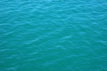 Blue sea surface with waves