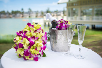 Champagne and a glass of champagne on the table for the wedding ceremony.