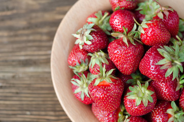 Strawberries ripe red on wooden table