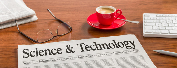A newspaper on a wooden desk - Science and Technology