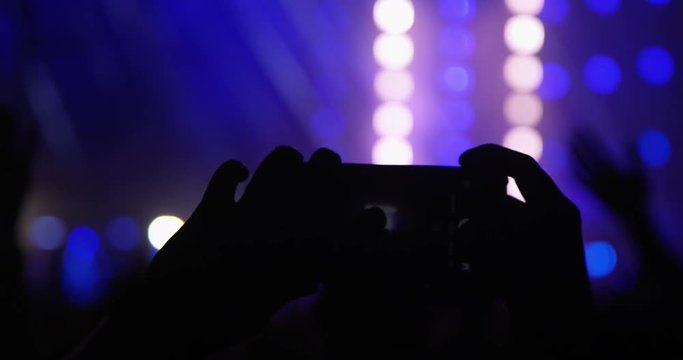 Close-up of Mobile Phone Shooting at Music Concert