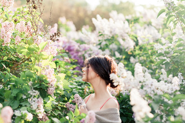 Young Girl in Lace bra Posing in Blossomed Lilac. Sunset tunes. Tender Mood