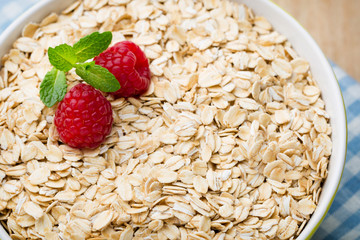 Oatmeal porridge with berries. Raspberries and blueberries.