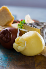 Cheese plate - Traditional Italian hard cheeses Parmesan, Grana Padano, Pecorino, Caciocavallo, Provolone