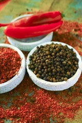 Red hot chili Cayenne and black pepper fresh and dried powdered spice, ready to use.