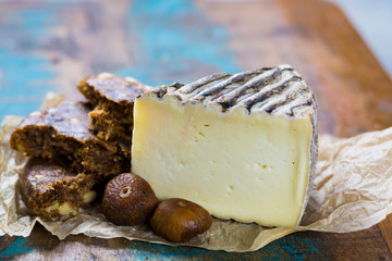 Ancient french cheese Tomme de Montagne and dried figs with figs bread