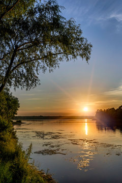 Sunset over the Dnieper river in Kiev, Ukraine, during a warm summer evening. © Maxal Tamor