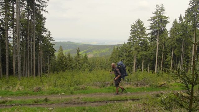 hiker walking on a trail, czechia, europe
