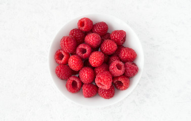 Closeup of Raspberries in White Bowl