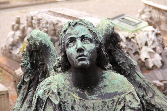 Winged Angel Woman Sculpture in Milan Monumental cemetery