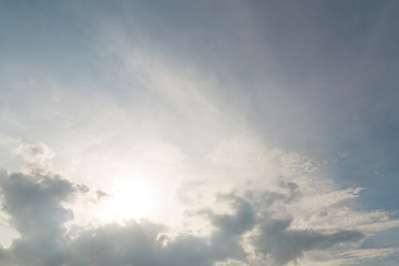 The blue backdrop has some clouds.