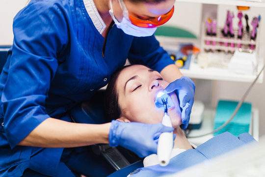 Young Woman Patient At A Reception At The Dentist