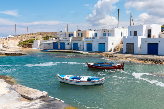 Traditional boat houses in the village of Agios Konstantinos on the coast of Milos island. Cyclades, Greece.