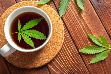 Cannabis herbal tea and marijuana leaves
