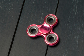 spinner on a wooden table. close up