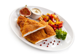 Fried pork chop coat in breadcrumbs and vegetable salad 