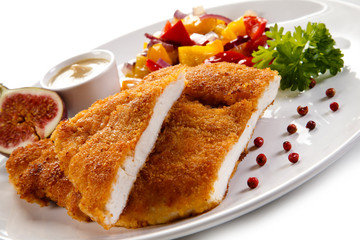 Fried pork chop coat in breadcrumbs and vegetable salad 
