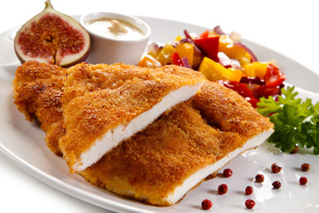 Fried pork chop coat in breadcrumbs and vegetable salad 