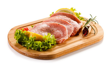 Fresh raw pork on cutting board on white background 