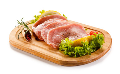 Fresh raw pork on cutting board on white background 