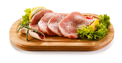 Fresh raw pork on cutting board on white background 