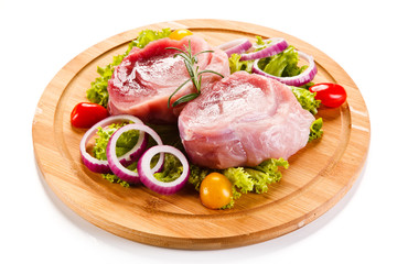 Fresh raw pork on cutting board on white background 