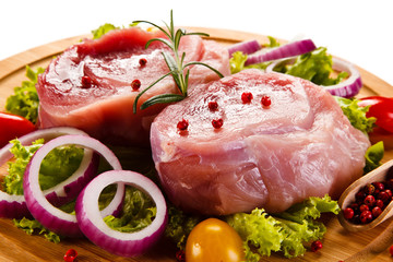 Fresh raw pork on cutting board on white background 