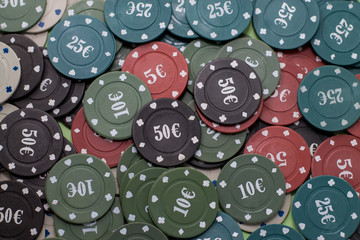 A lot of chips to play poker. Top view of a close-up