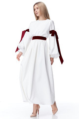 Beautiful sexy pretty fashion model blond hair woman wear style for party office clothes organic natural silk dress strips bow white background makeup lady designer collection.