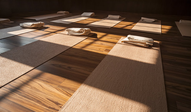 Yoga studio interior with carpets and towels