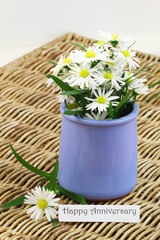 Happy Anniversary card with white daisies in blue vase

