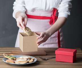 Housewife prepare gingerbread cookies as gift