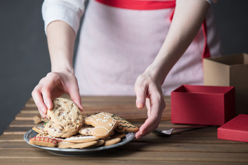 Housewife prepare gingerbread cookies as gift