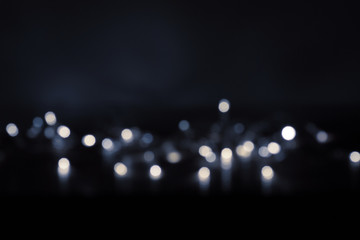 Dark background with silver bokeh